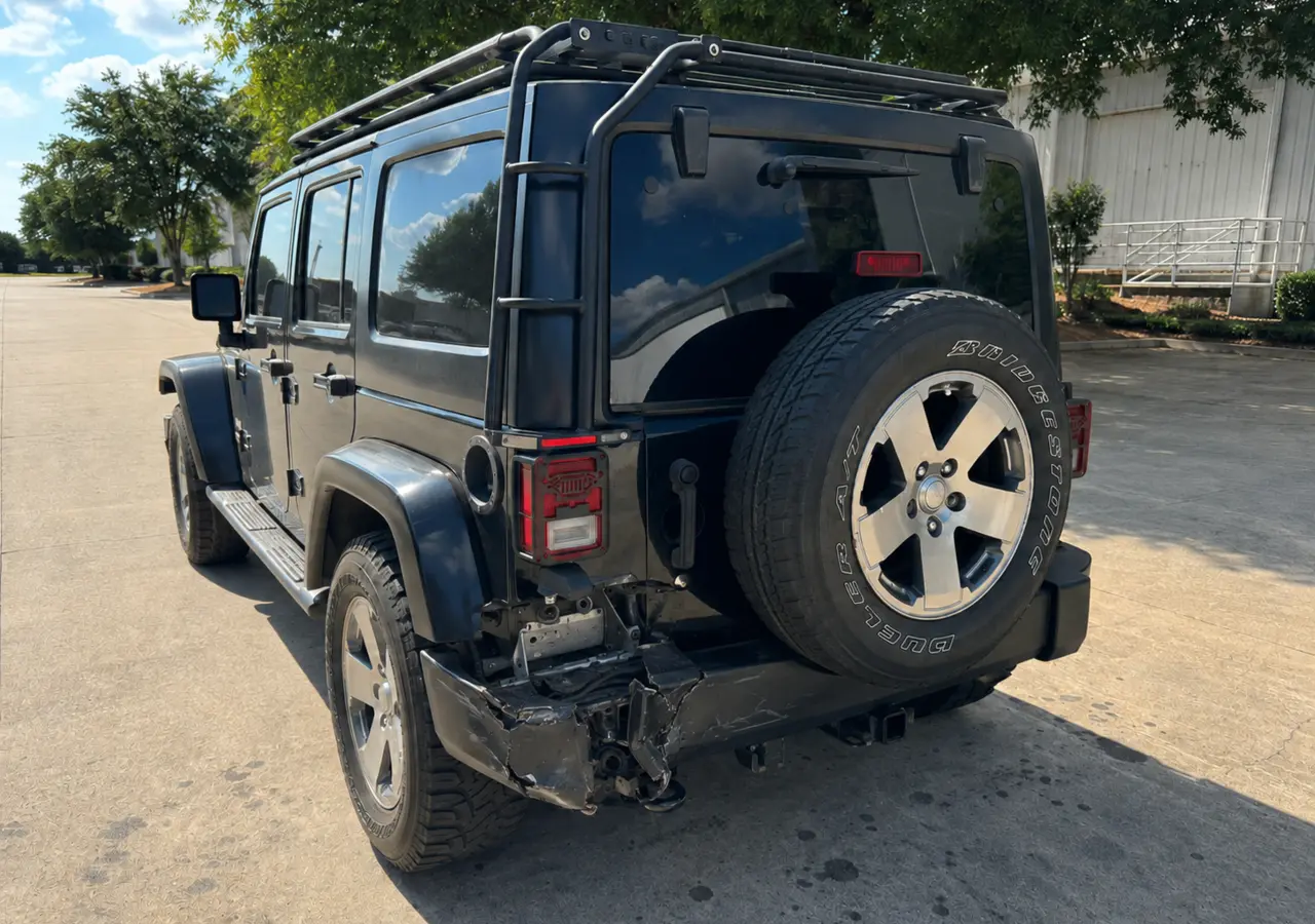 Jeep rear bumper collision damage before repair
